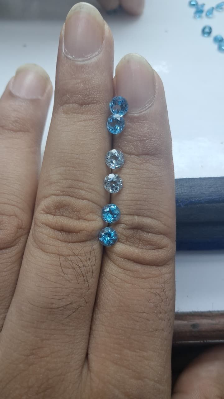 Center stones photographed at the factory for buyer selection